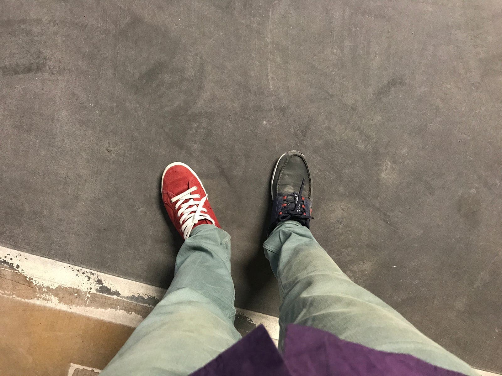 One red shoe and one black, on a morning during the Muud relaunch
